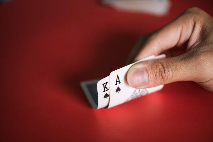 Close-up of dealer dealing cards in live studio